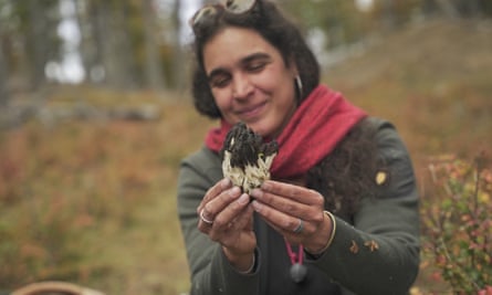 Giuliana Furci holding up a mushroom